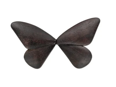 Small hand carved wooden sculpture of a moth