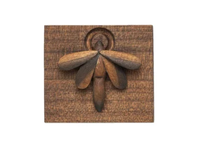 Small hand carved wooden sculpture of moth