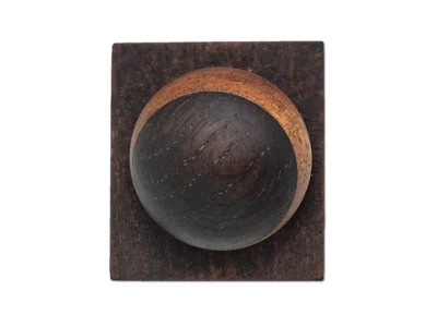 Small hand carved abstract wooden sculpture of eclipse