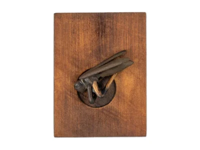 Small hand carved wooden sculpture of insect