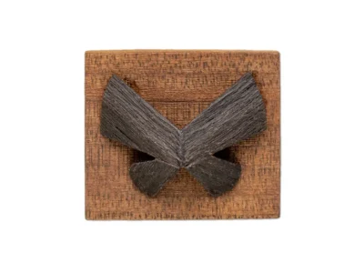 Small hand carved abstract wooden sculpture of moth