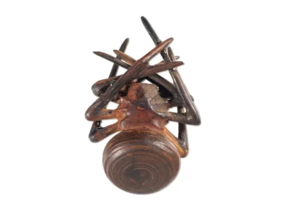 Small hand carved wooden spider sculpture