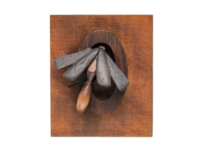 Small hand carved wooden insect sculpture